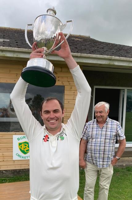 Sean Hannon raises the superb silverware aloft